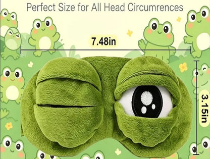 Frog Sleep Mask — A stylish, shimmering sleep mask featuring an adorable "Sad Frog" design. This fun, plush eye mask is perfect for travel, yoga, napping, and light-blocking; its soft cotton lining gently cares for sensitive skin.